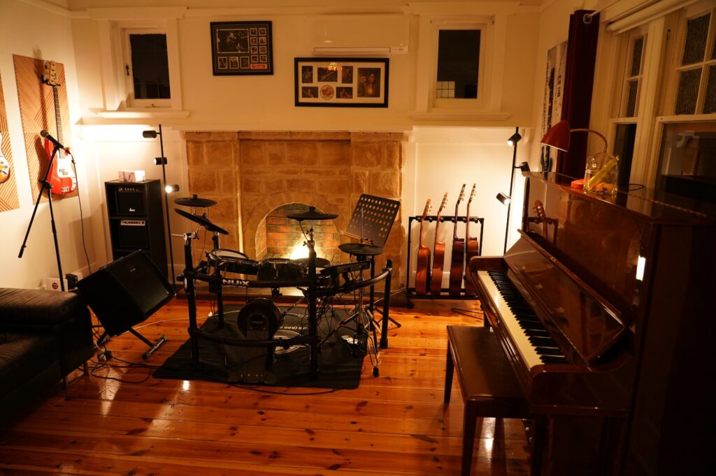 Music school facilities with drums, upright piano and guitars at BeSharp Music School in Tusmore, Adelaide